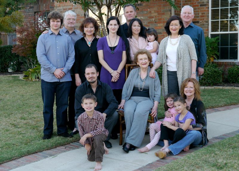 Mavis celebrating her 90th birthday with her daughters, son-in-laws, grandchildren, and great grandchildren.